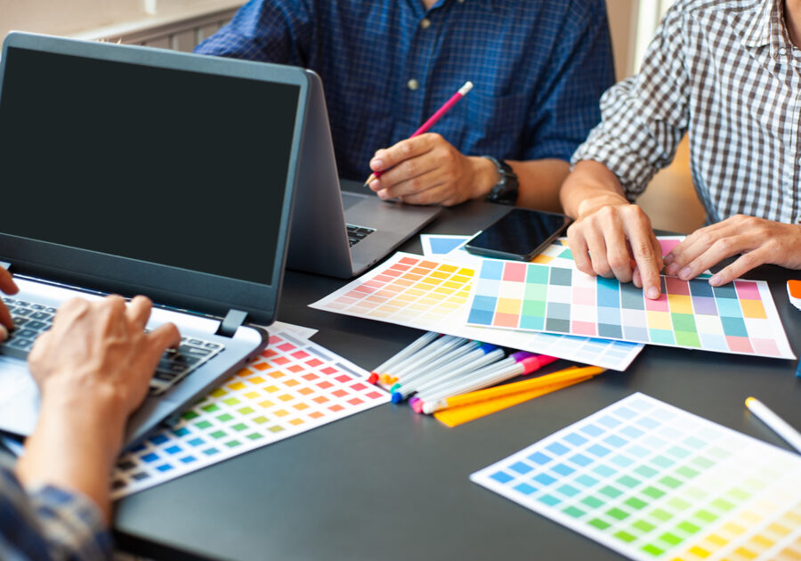Team,Of,Professional,Designers,Work,Together,At,The,Office,Desk.