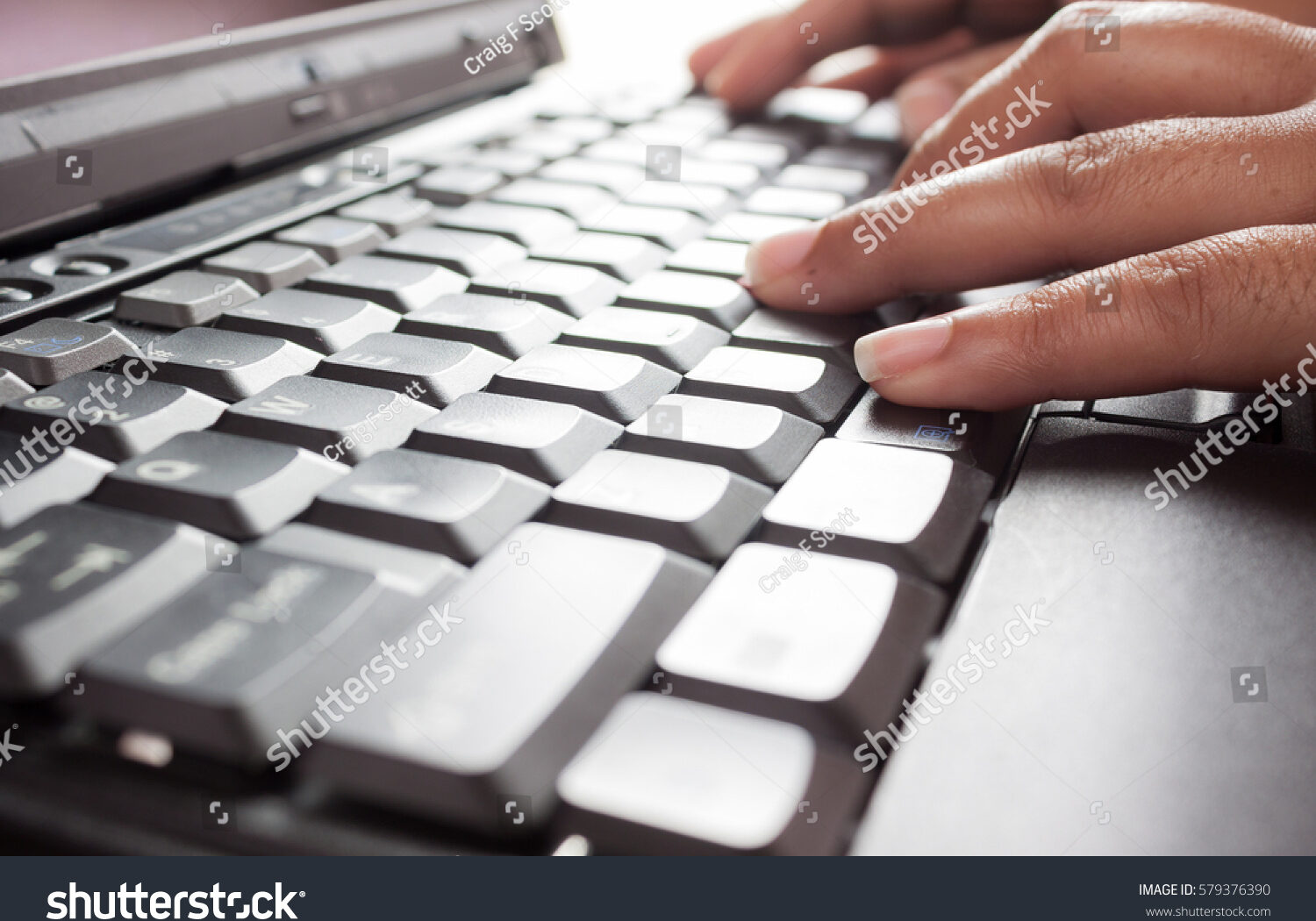 stock-photo-hands-typing-on-keyboard-579376390